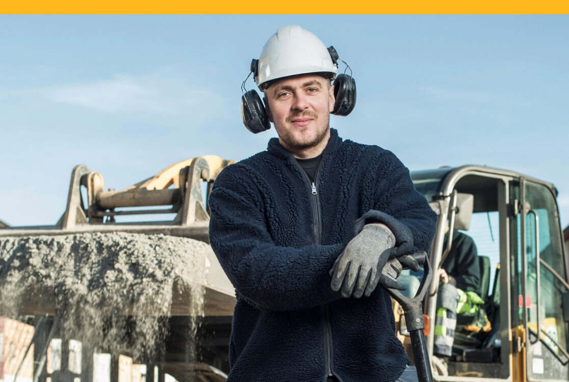Worker standing at construction site