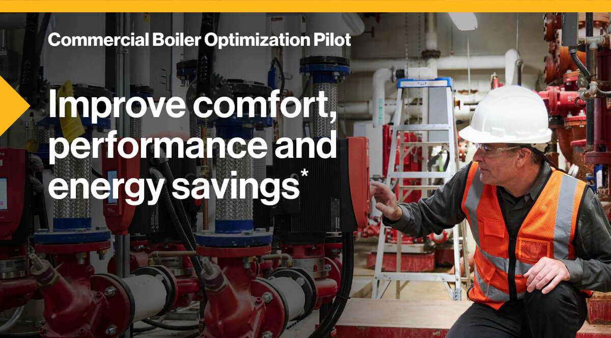 Commercial Boiler Optimization Pilot. Improve comfort, performance and energy savings*: Image of an engineer, wearing safety equipment while making adjustments to a modern boiler.